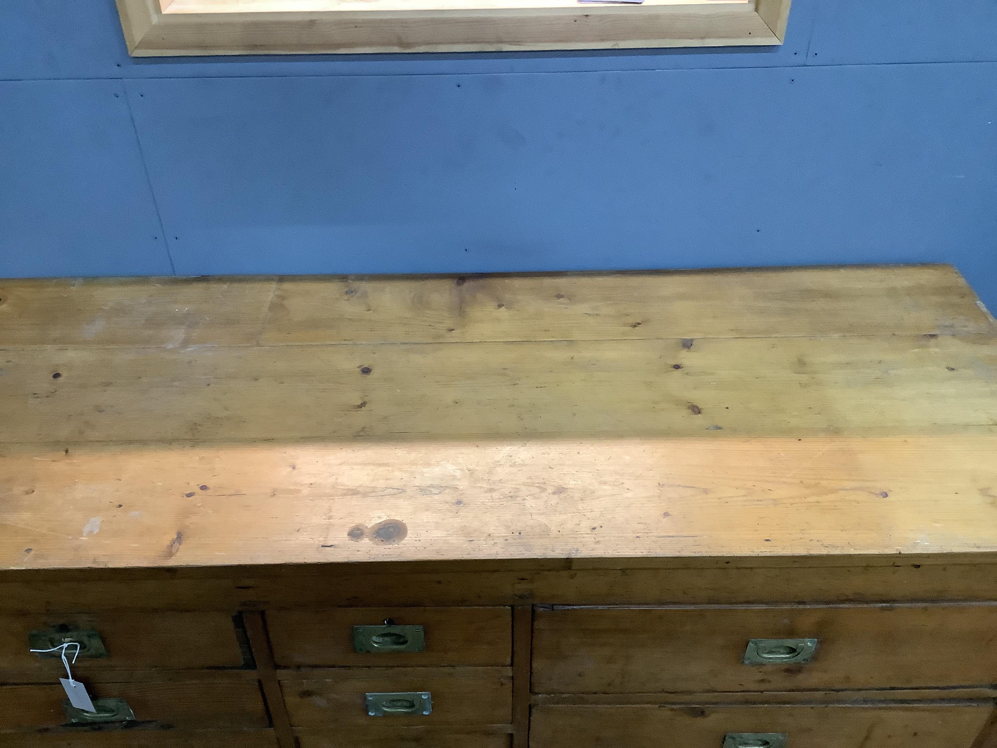 A pine counter ten drawers, width 164cm, depth 62cm, height 86cm